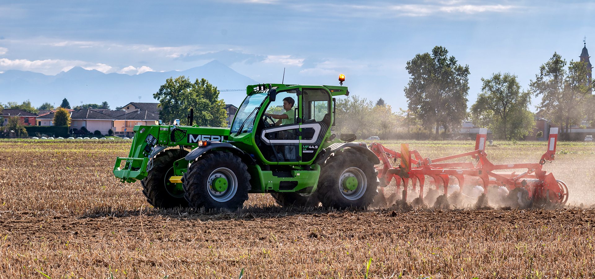 Automotive tire, Agricultural machinery, Motor vehicle, Wheel, Sky, Cloud, Tractor, Plant
