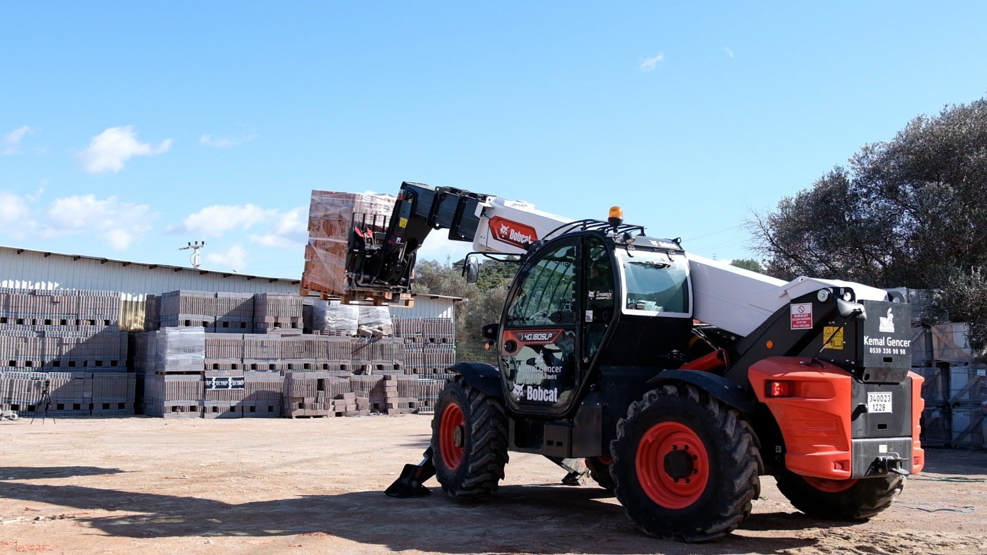 Automotive tire, Motor vehicle, Wheel, Sky, Tread, Tractor, Tree, Cloud