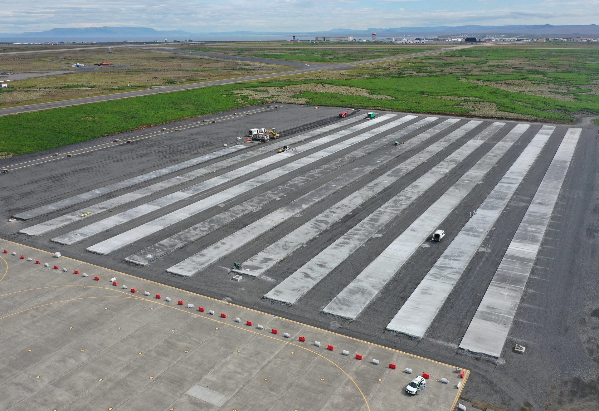 Land lot, Urban design, Road surface, Composite material, Sky, Infrastructure, Runway, Asphalt, Cloud