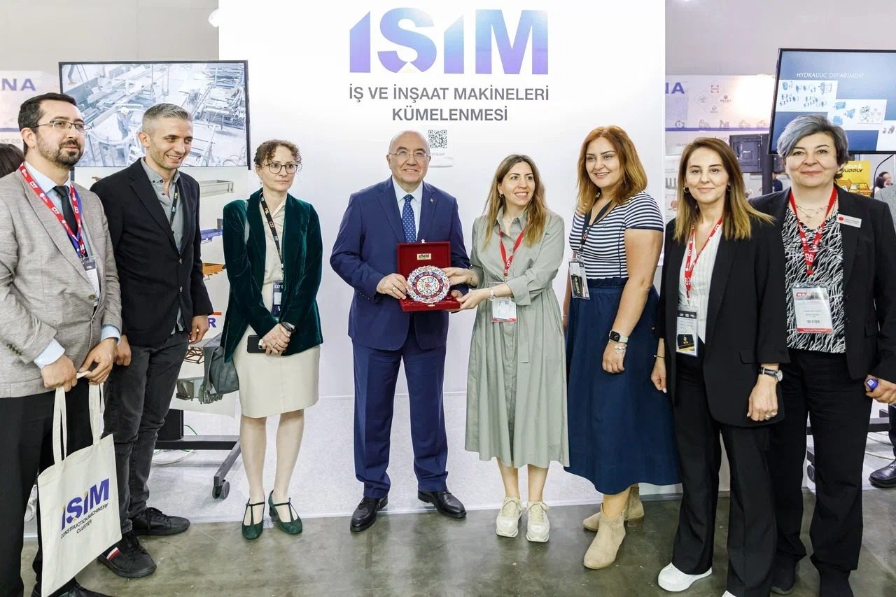 Suit trousers, Automotive design, Social group, Smile, Shoe, Product, Coat