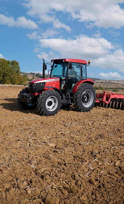 Automotive tire, Agricultural machinery, Motor vehicle, Wheel, Sky, Cloud, Tractor, Tread