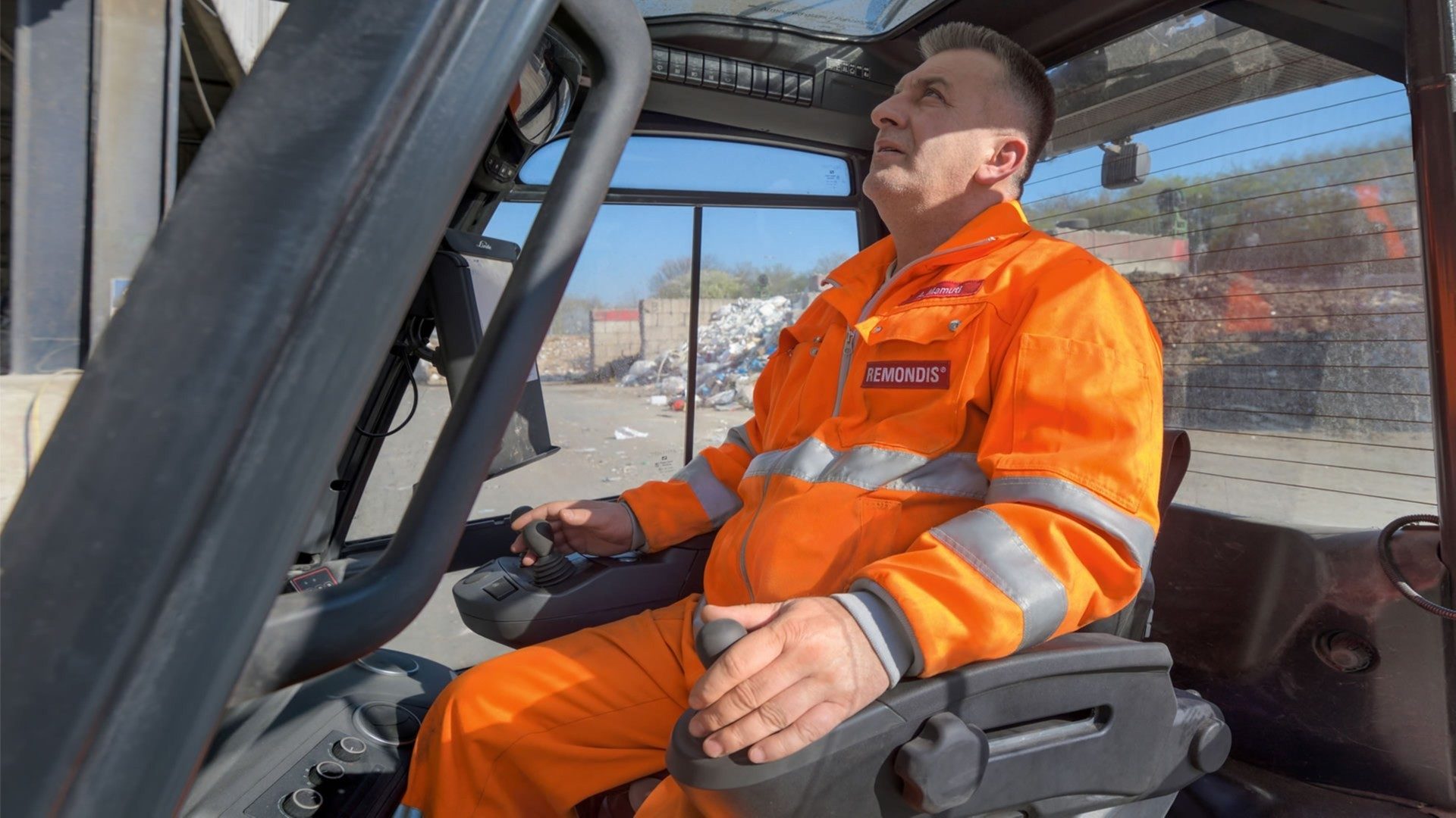 Motor vehicle, Seat belt, Truck driver, Automotive design, Workwear, Window, Orange