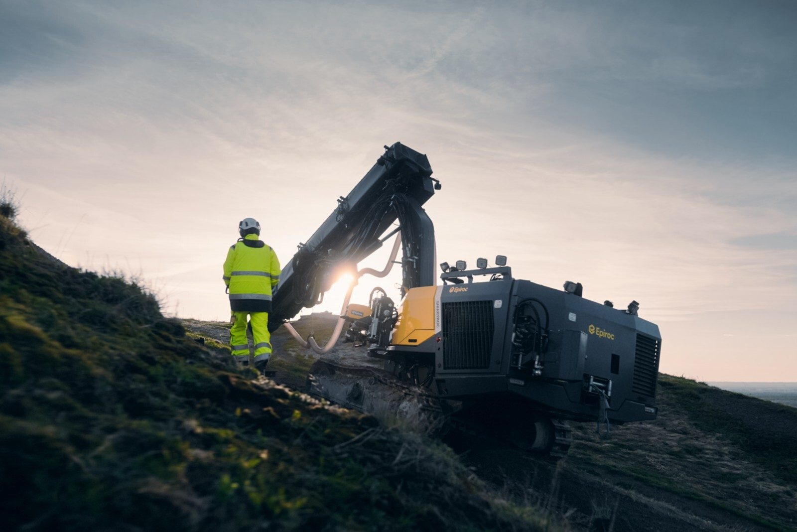 Automotive tire, Cloud, Sky, Vehicle, Wheel, Slope, Asphalt, Terrain, Truck, Bulldozer