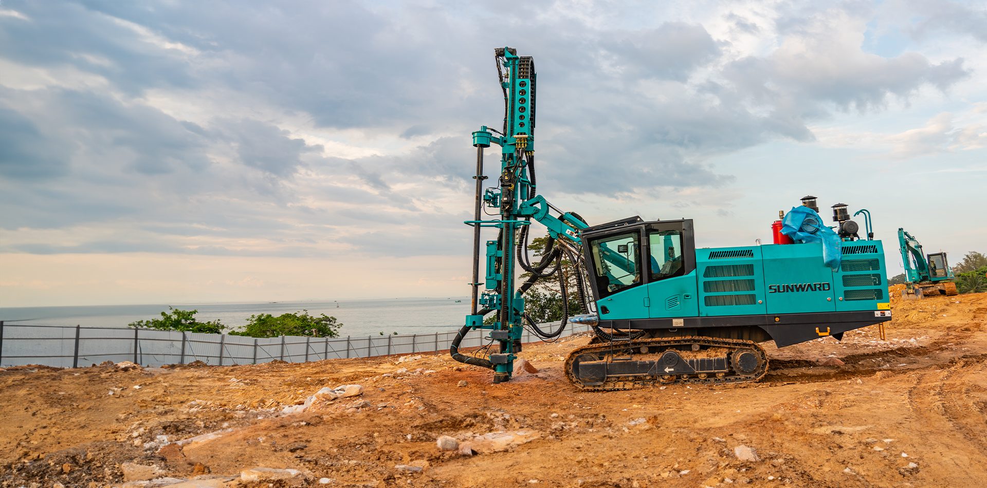 Natural environment, Land lot, Cloud, Sky, Ecoregion, Vehicle, Water, Plant, Grass, Wheel