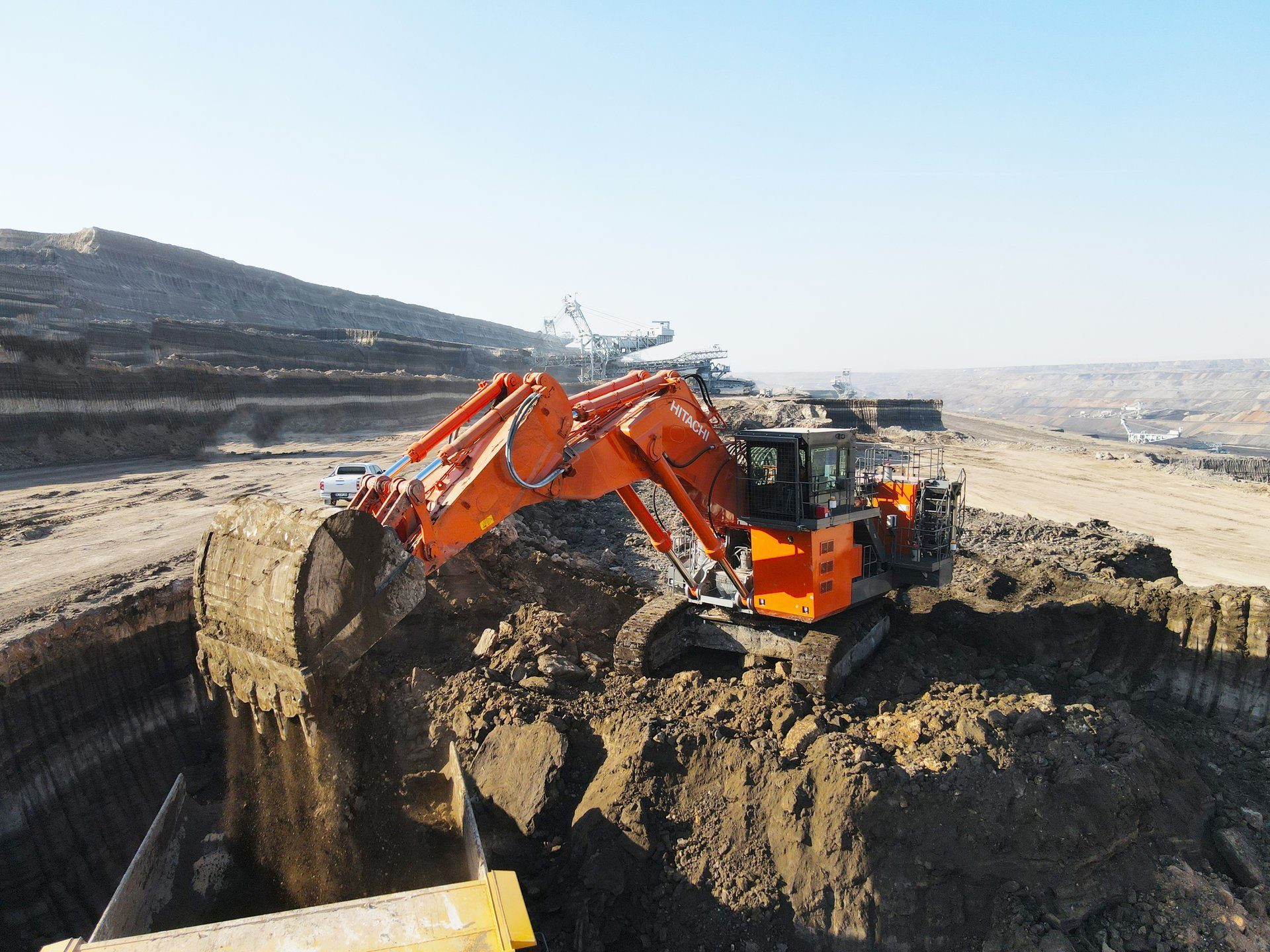 Land vehicle, Down-the-hole drill, Automotive tire, Sky, Slope, Asphalt, Truck