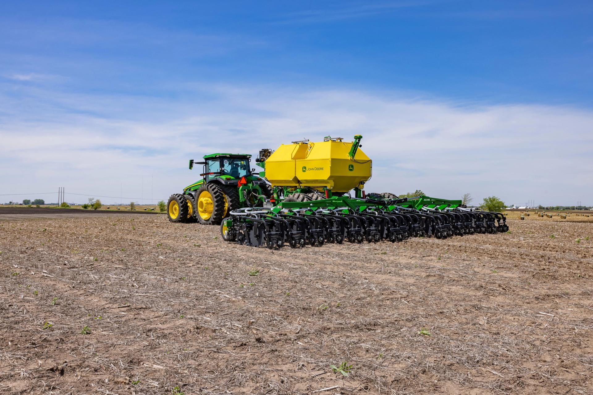 Agricultural machinery, Automotive tire, Wheel, Sky, Vehicle, Tractor, Cloud, Plant, Agriculture