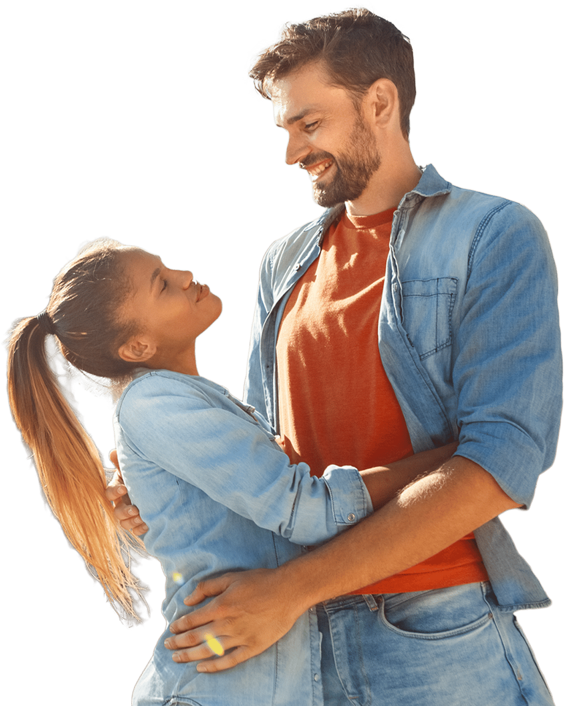 Young new homeowner couple embracing and smiling.