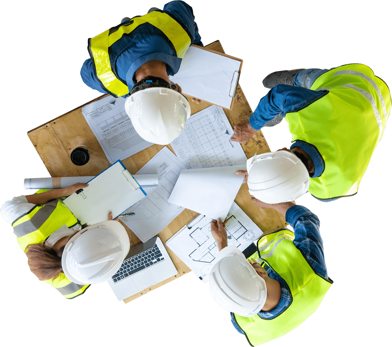 Overhead view of a group of contractors meeting around a table of laptops and blueprints.