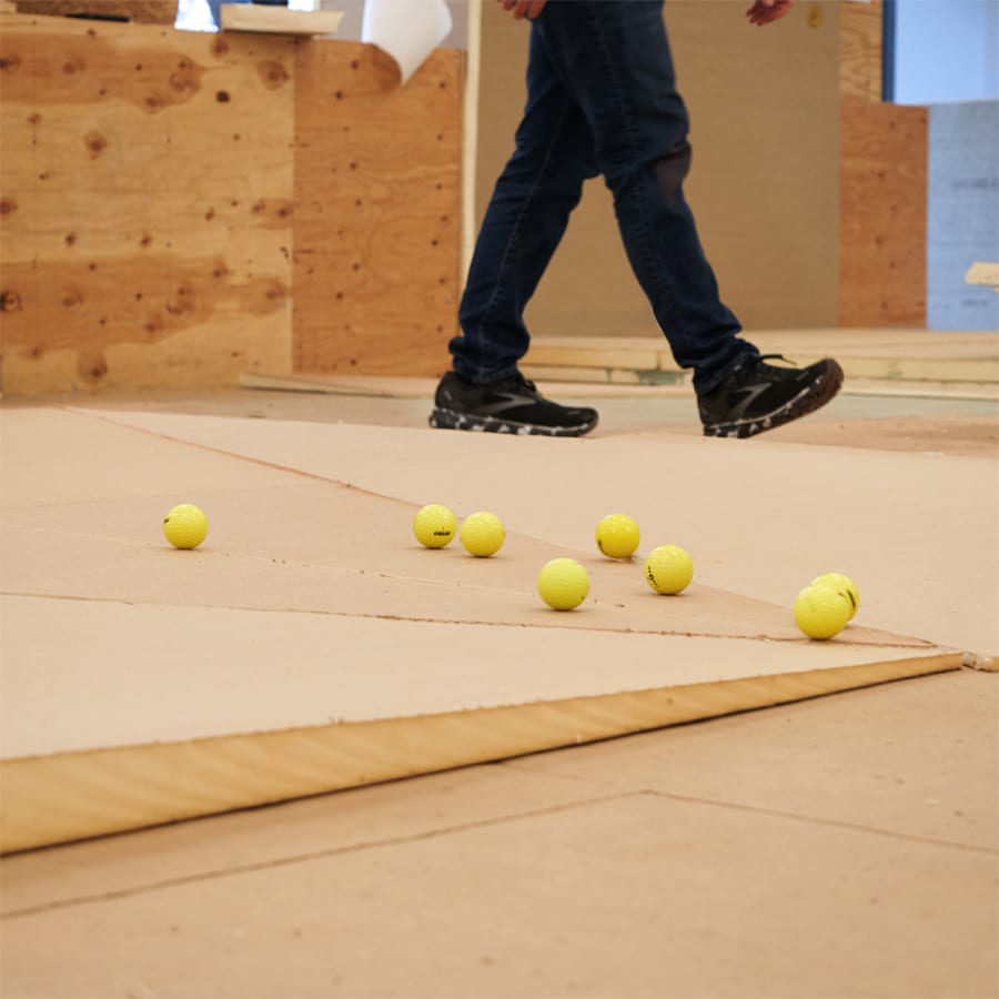 yellow balls rolling down tapered insulation