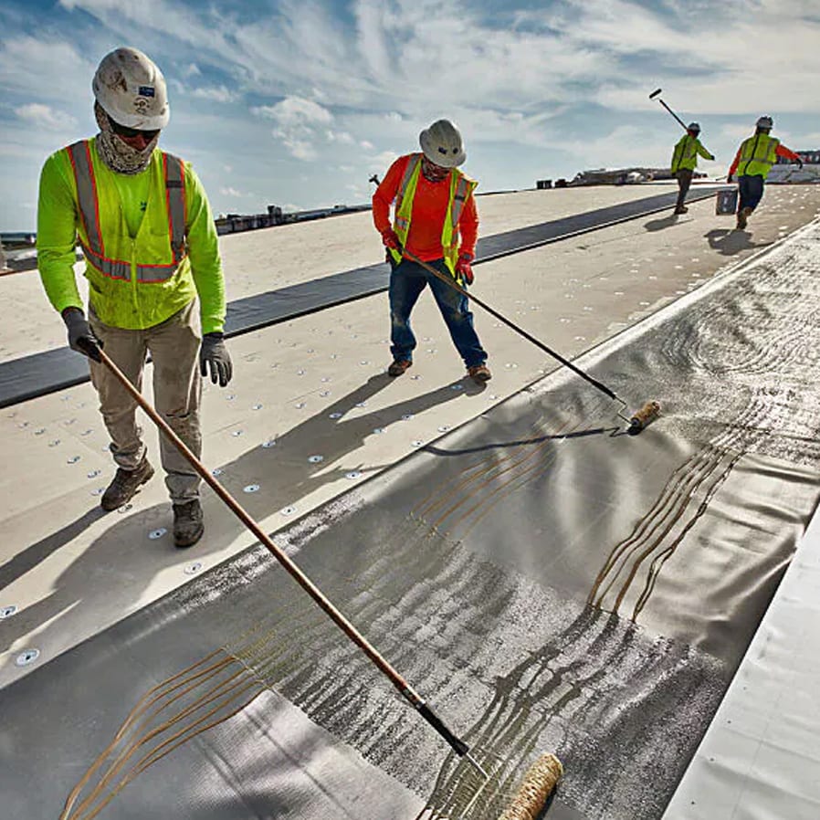 A flat commercial roof installation in progress.