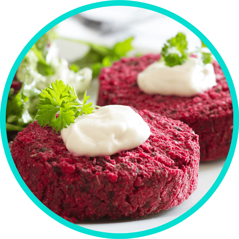 Close up of two beet burgers on a plate