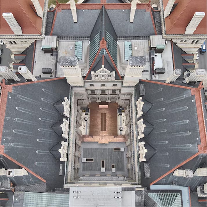 Overhead view of a historic property image with roof open to show interior.