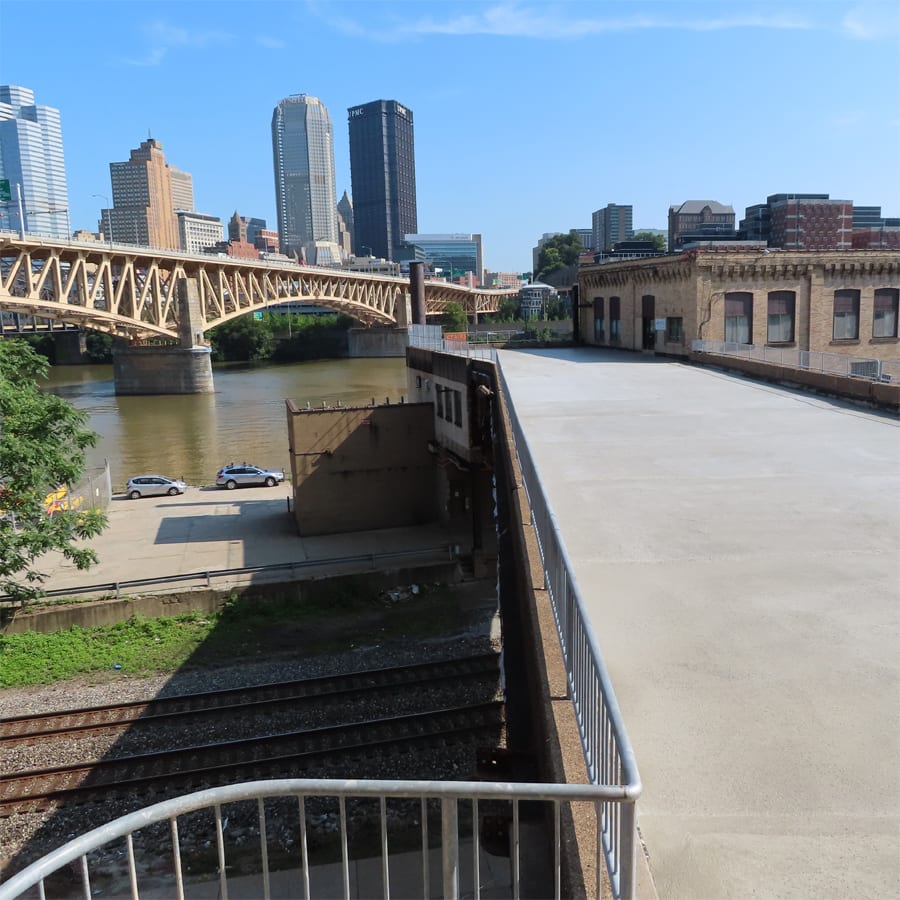 View of the Pittsburgh Highline with skyline of city in the distance.