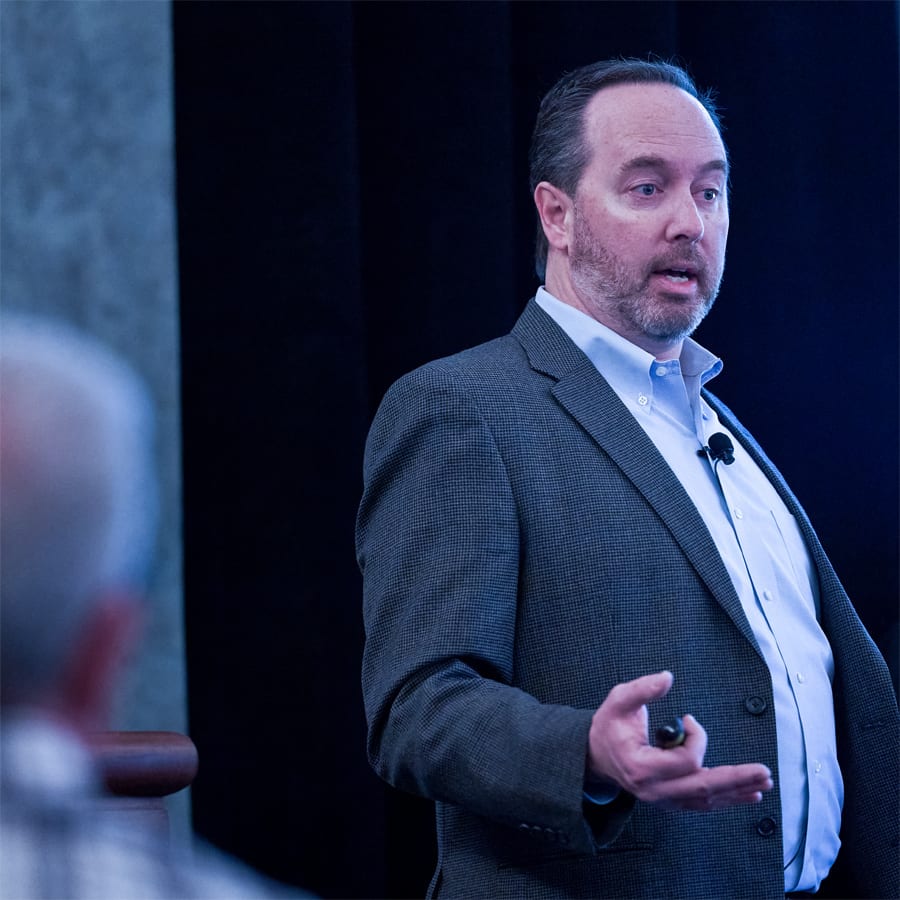 roofing professional in suit giving a presentation