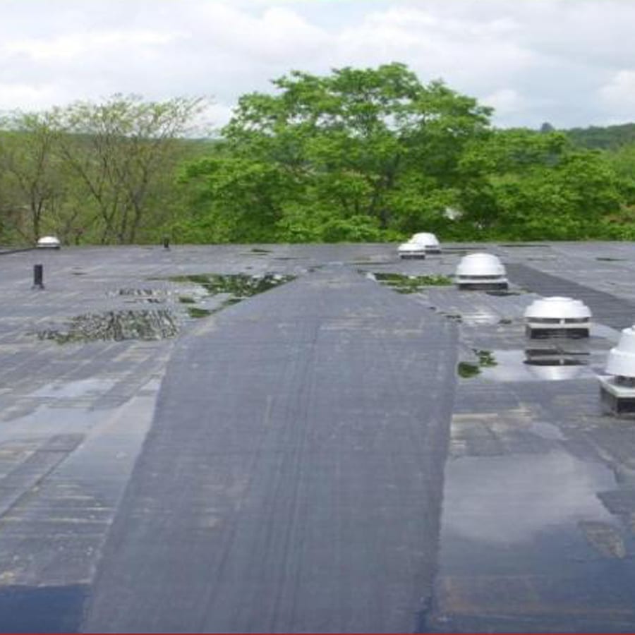 Commercial roof with pooling water.