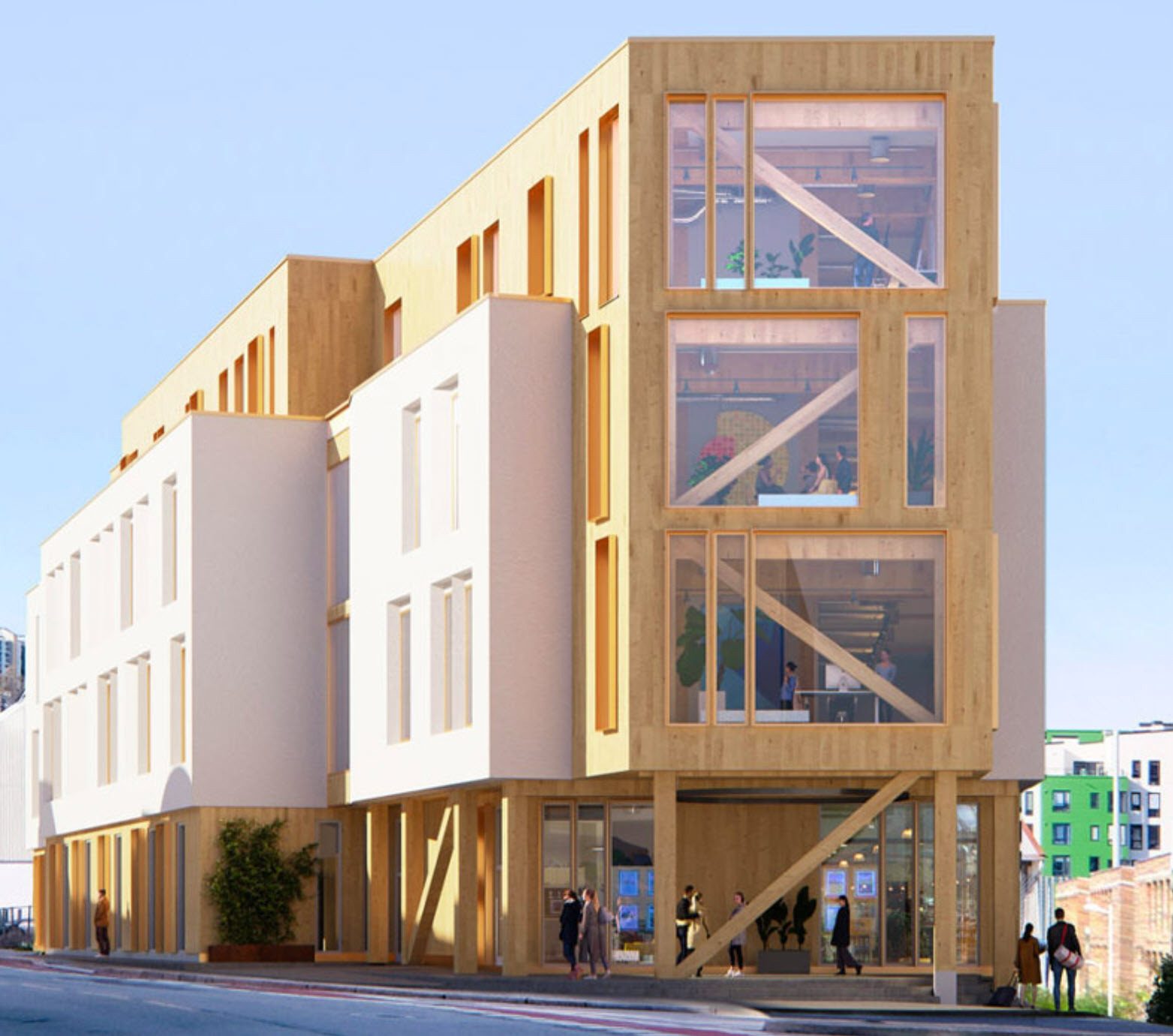 Modern building of wood and white with large windows, visible timber structure.