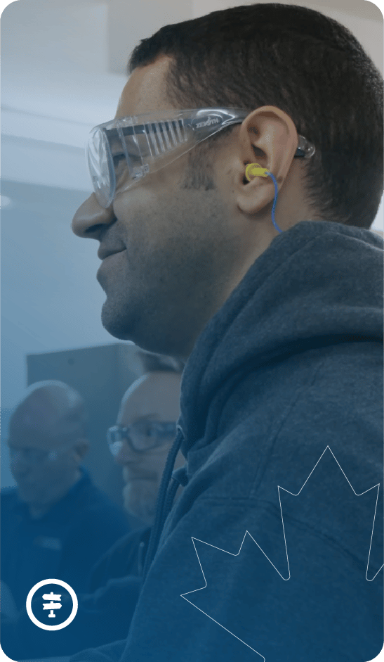 Person smiling with safety googles on.
