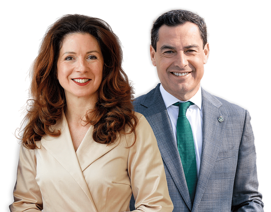 Two smiling politicians, a woman in beige and a man in a gray suit and green tie.