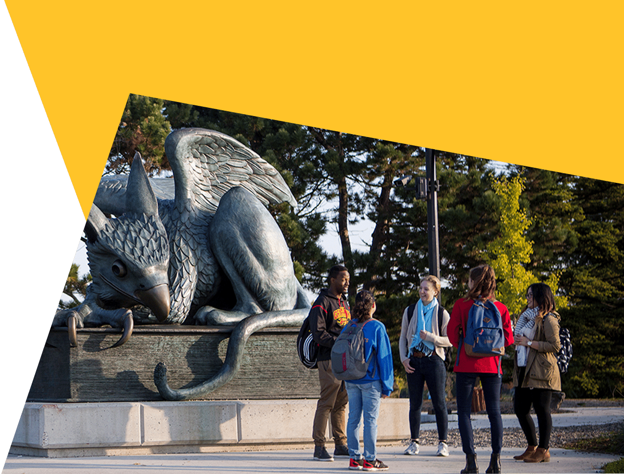 Bronze griffin statue and five students, with a yellow and green overlay.
