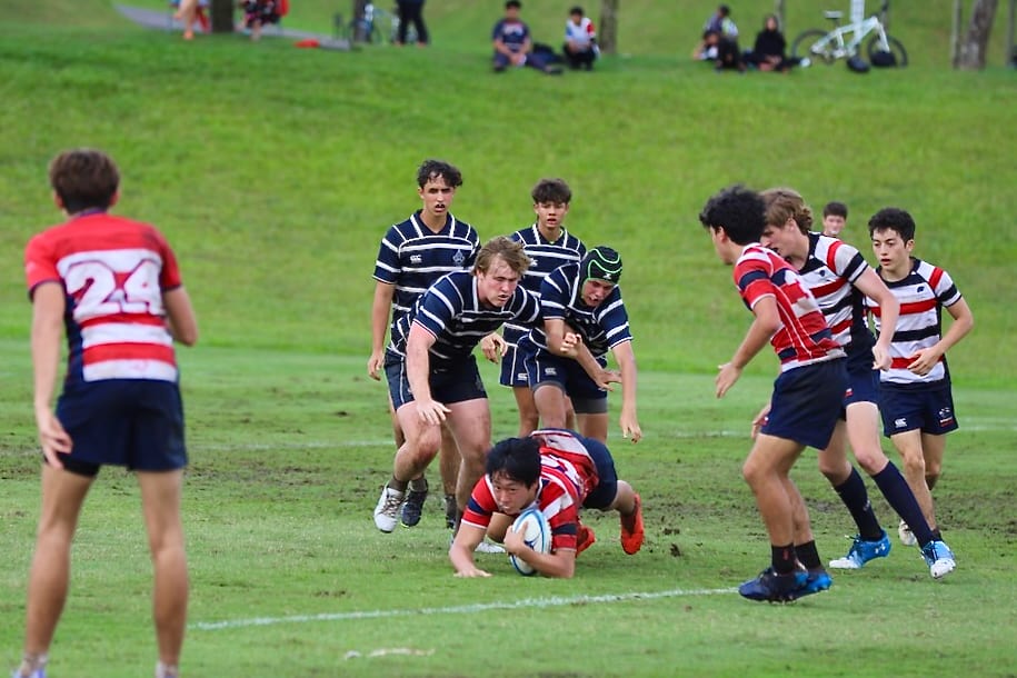 Rugby league sevens, Sports equipment, Ball game, Shorts, Cleat, Player, Grass