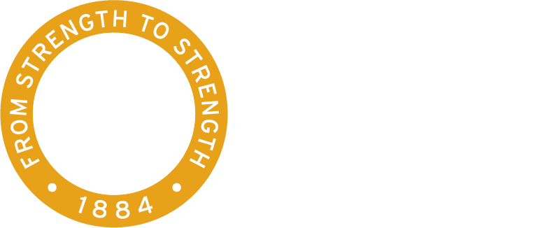Logo for Annie Wright Schools. Circular emblem with arches, "From Strength to Strength", and "1884".