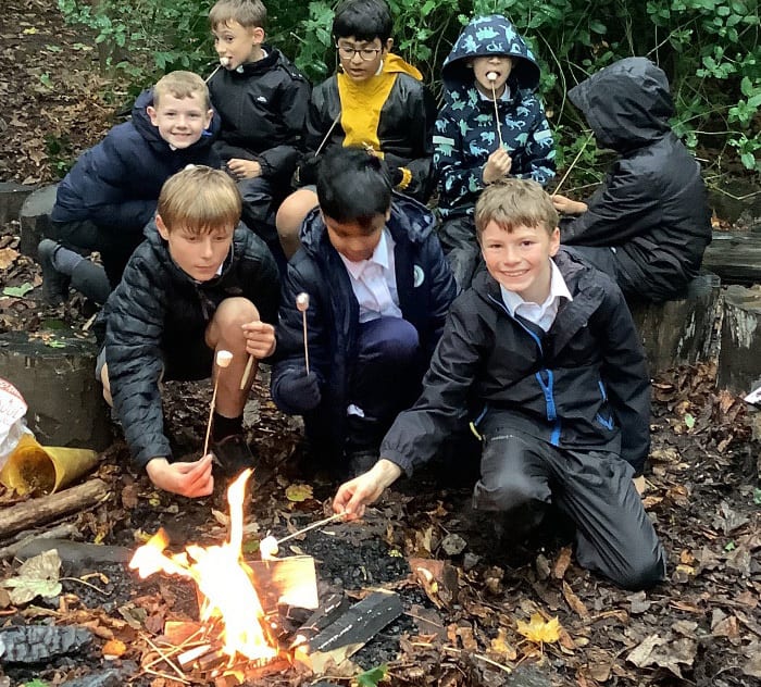 People in nature, Natural environment, Outerwear, Smile, Fire, Biome, Jacket