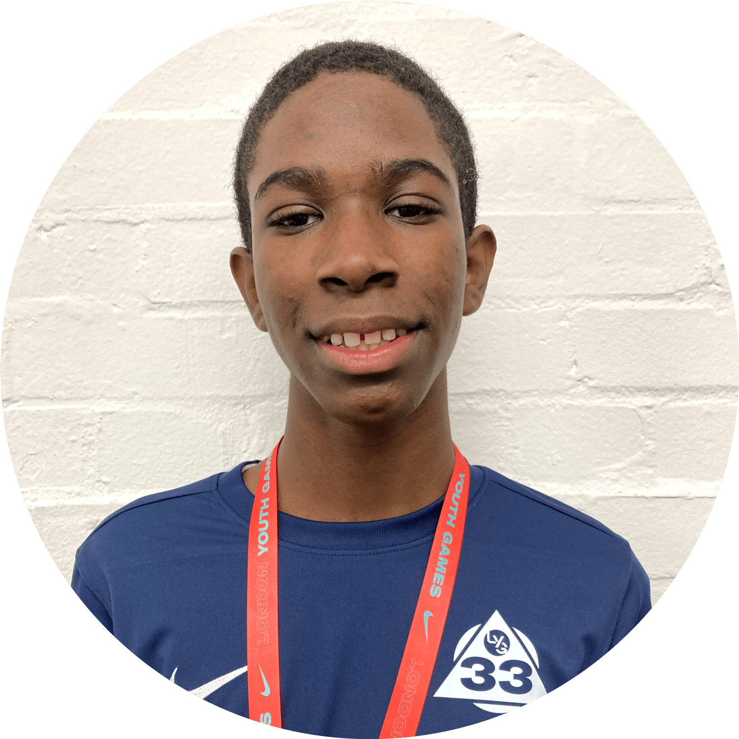 Black male smiling wearing a LYG33 T-shirt