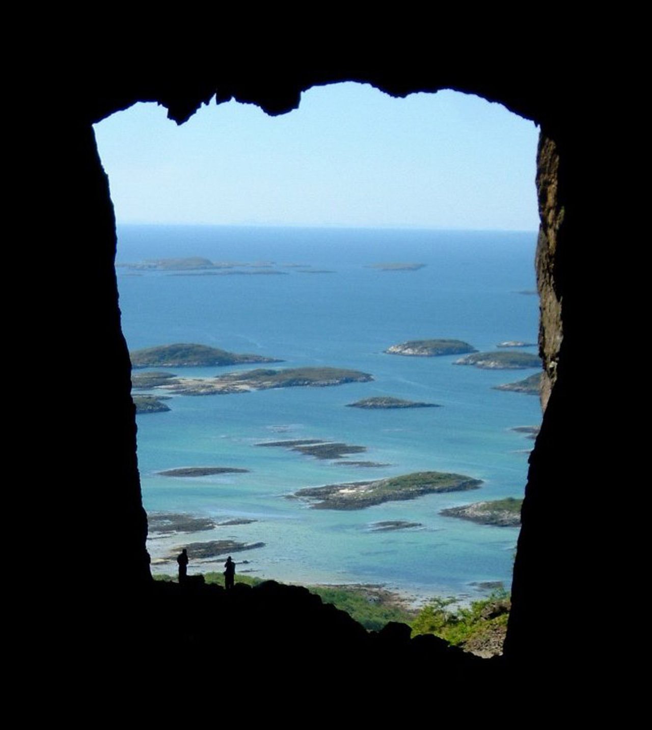 Coastal and oceanic landforms, Body of water, Natural landscape, Sky, Azure, Window, Plant, Lake, Terrain