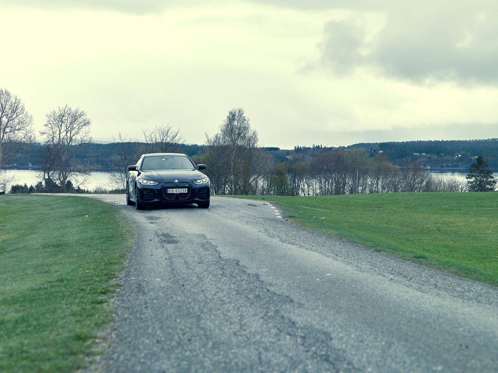Automotive design, Road surface, Tire, Cloud, Car, Sky, Wheel, Vehicle, Plant, Tree