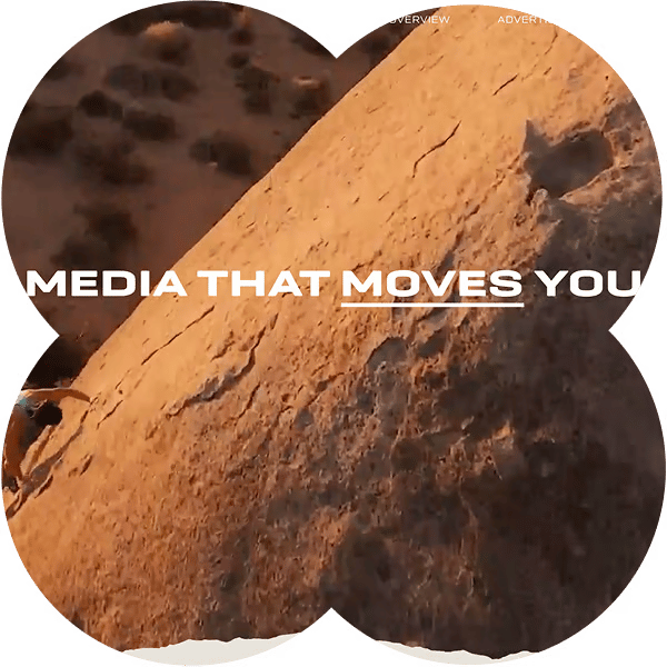 Text "MEDIA THAT MOVES YOU" over a rock climbing scene in a desert setting.