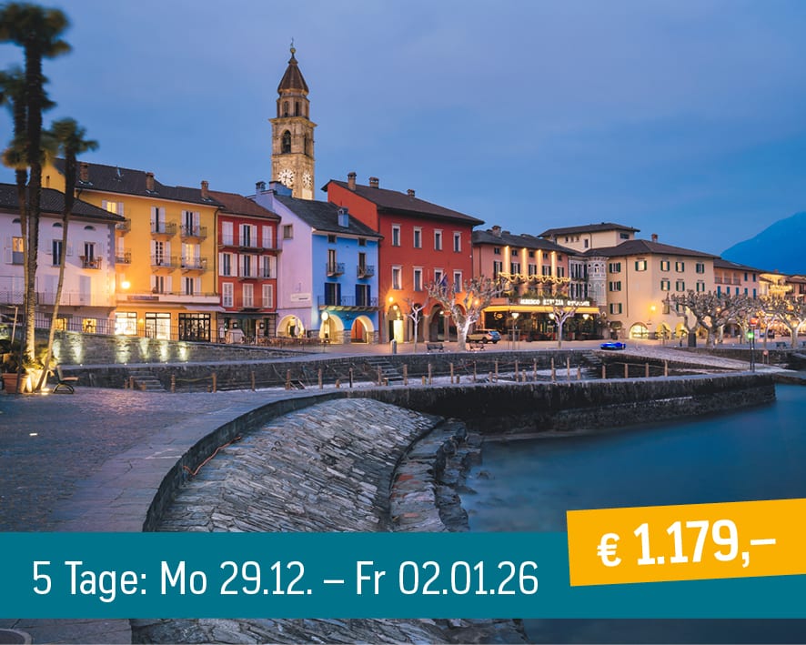 Colorful waterfront town at dusk with a prominent bell tower. Includes German text with dates and price.