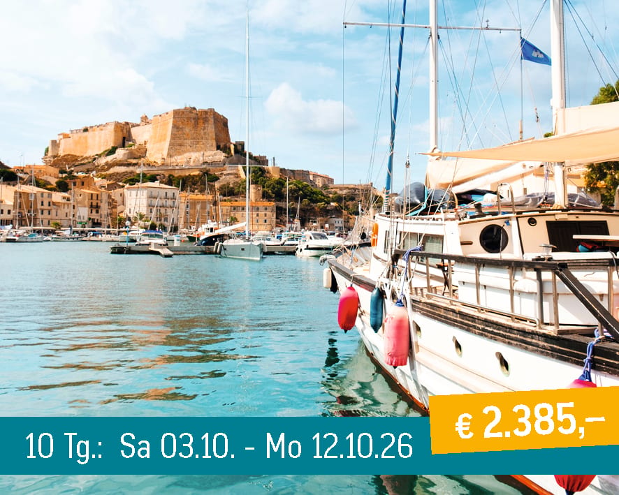 Scenic harbor view with a historic fortress on a hill, surrounded by yachts and clear blue water.
