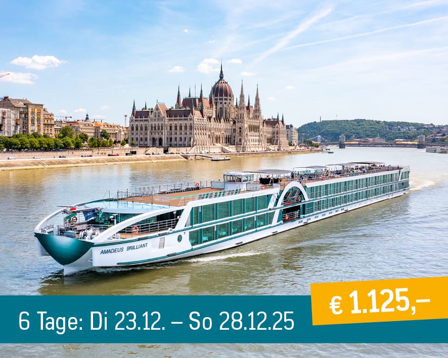 Amadeus Brilliant cruise ship by Budapest Parliament. Text: 6 days, €1,125.