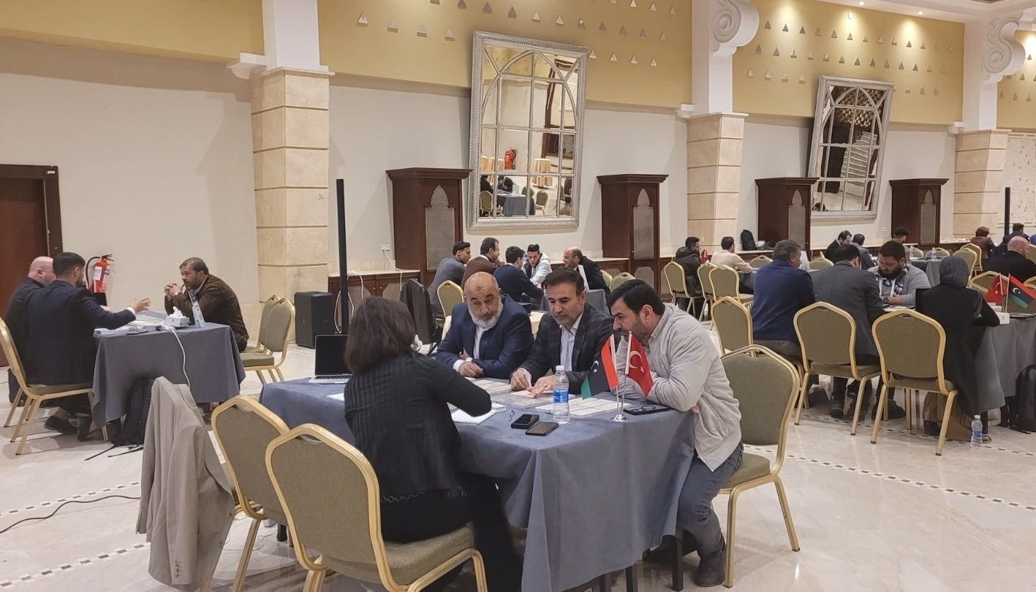 Interior design, Furniture, Event, Hall, Flooring, Chair, Suit, Coat, Crowd
