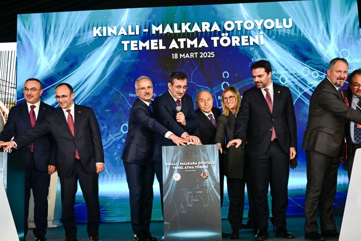 Formal wear, White-collar worker, Suit, Event, Coat, Logo, Smile, Blazer, Necktie, Advertising