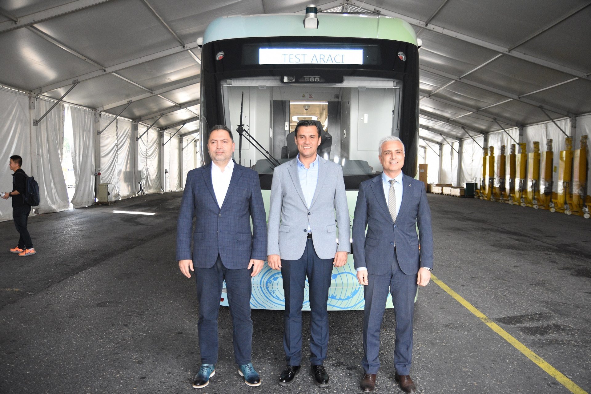 Mode of transport, Automotive design, Motor vehicle, Trousers, Smile, Train, Sleeve, Travel, Collar, Suit