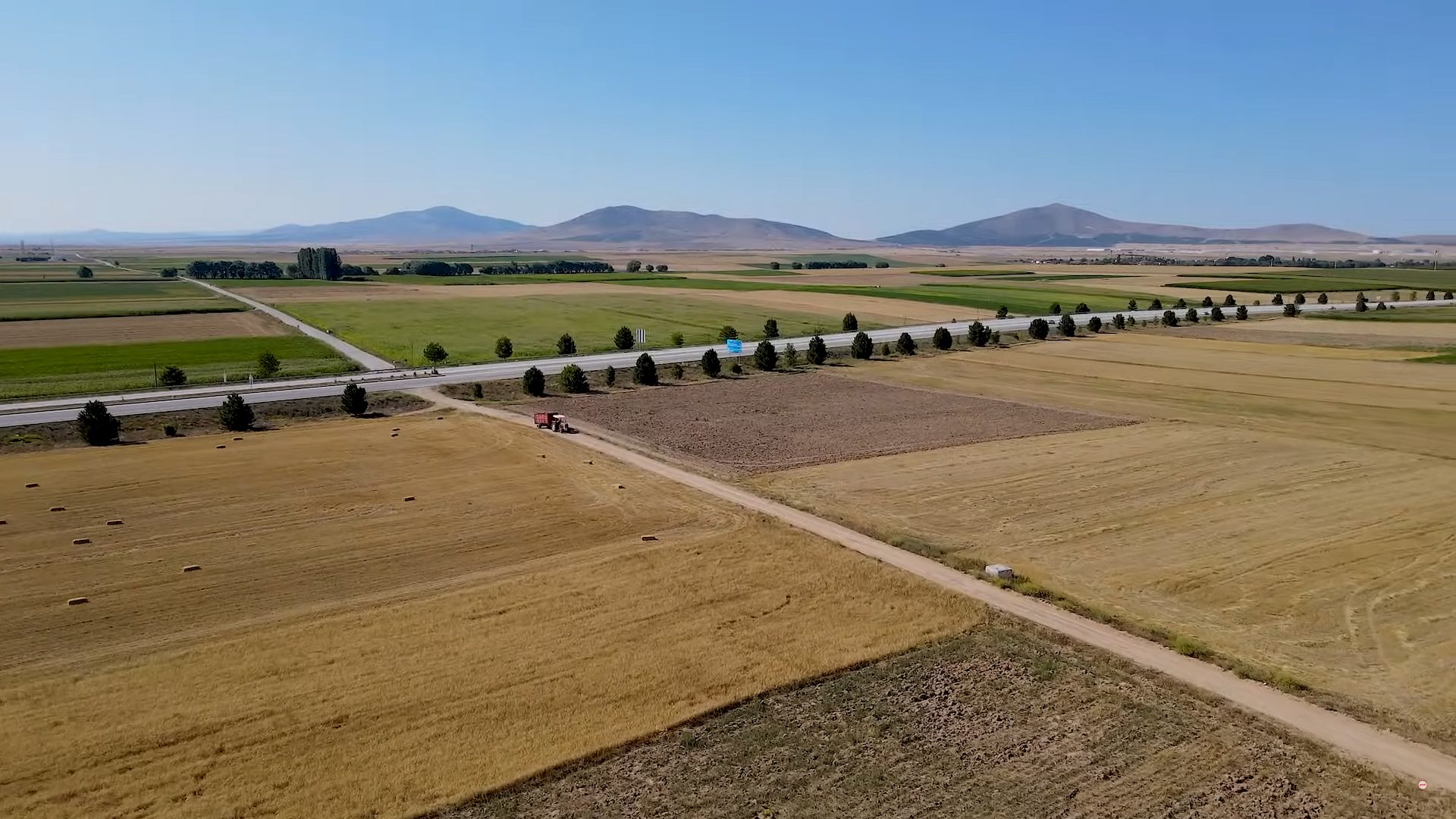 Land lot, Sky, Vehicle, Plant, Aircraft, Asphalt, Runway