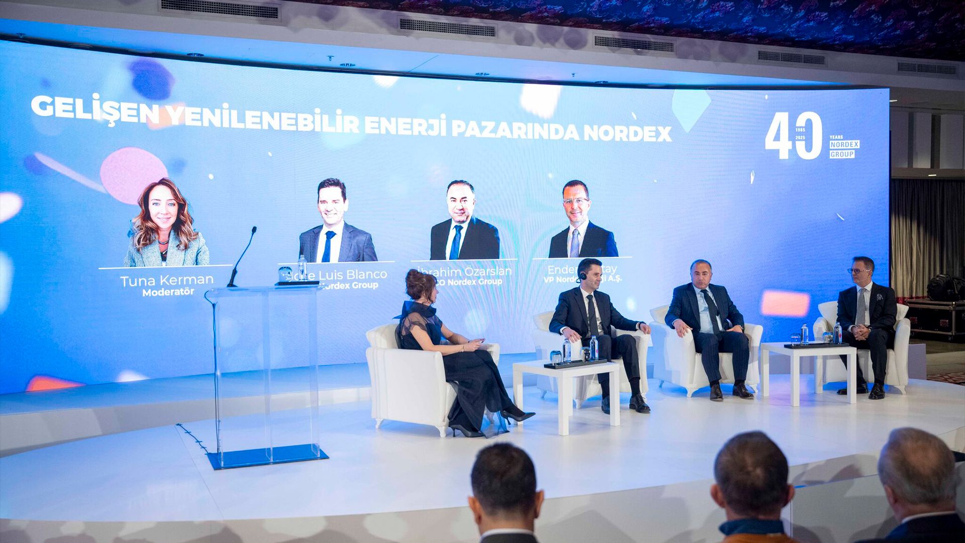 Panel discussion with Nordex Group executives on renewable energy.