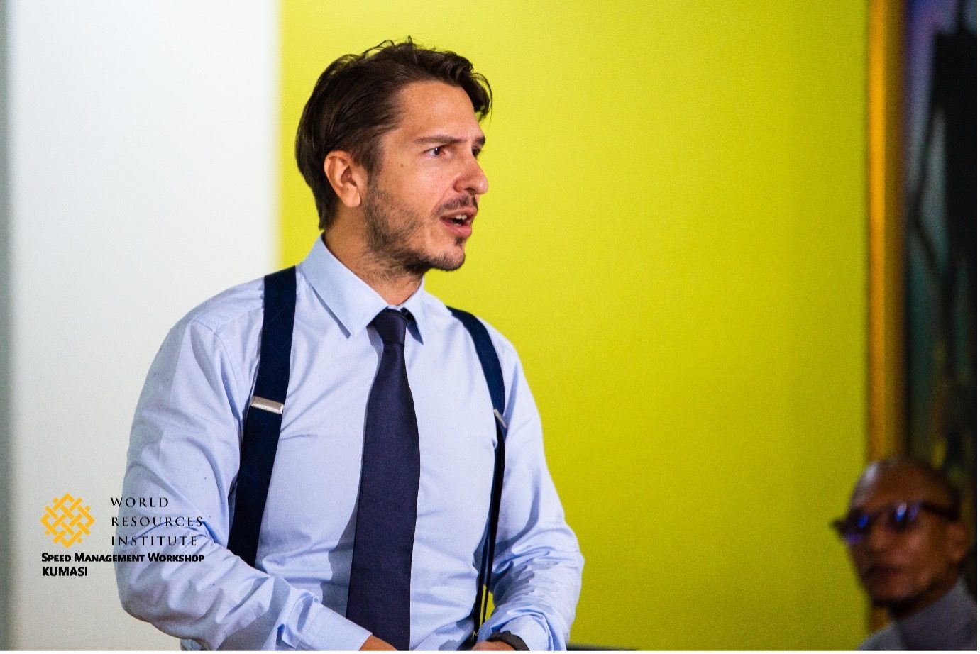 Man in shirt, tie, and suspenders speaking at a World Resources Institute workshop.