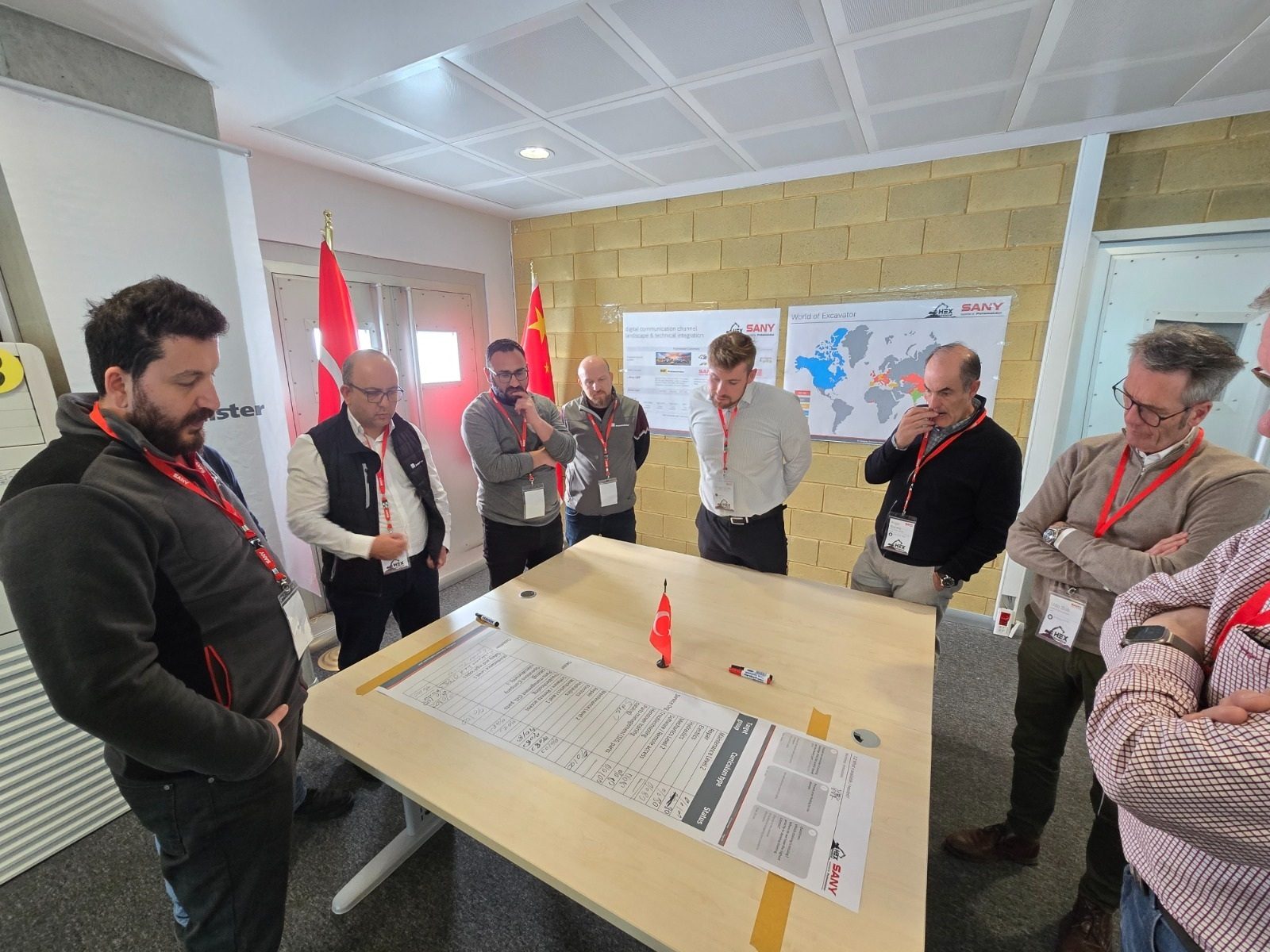 Clothing, Furniture, Arm, Outerwear, Trousers, Shirt, Table, Coat, Interaction, Chair