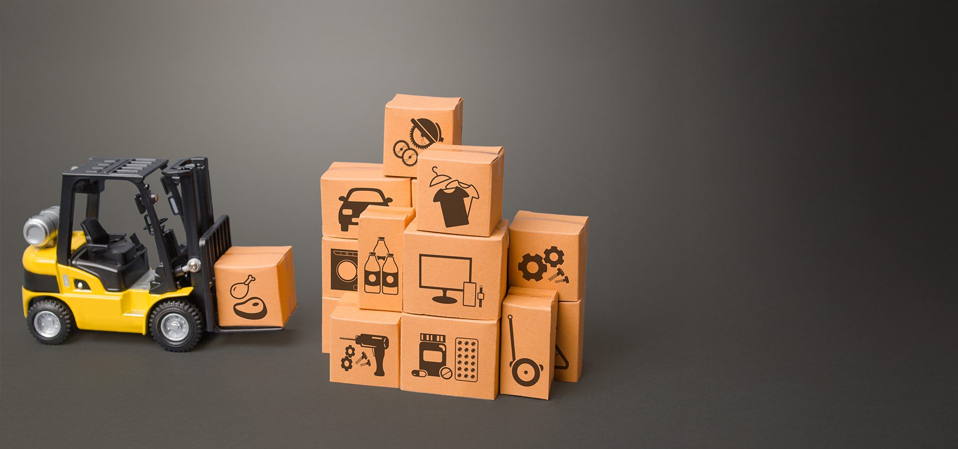 Yellow toy forklift with a box, next to stacked boxes with diverse product icons.
