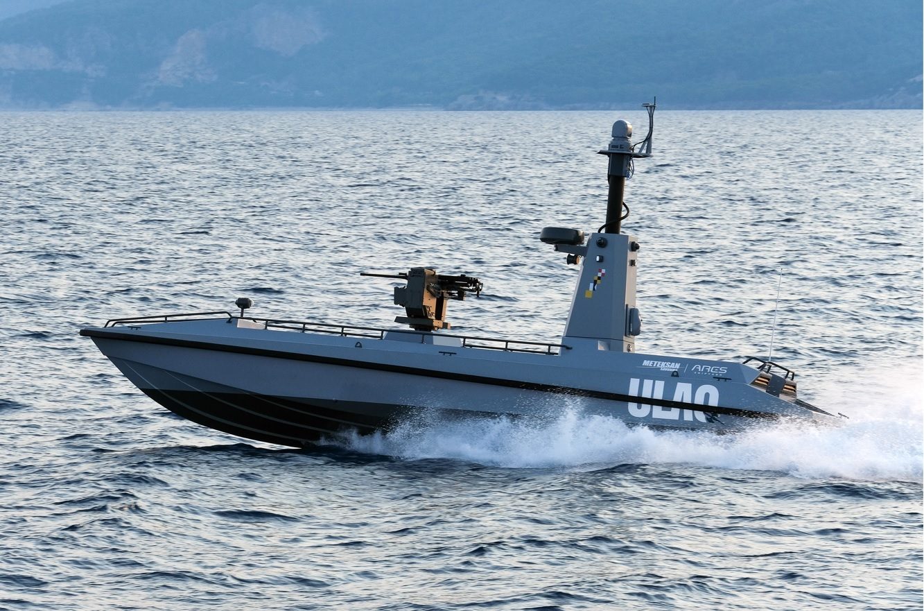 Armed gray ULAQ USV speeding on water.