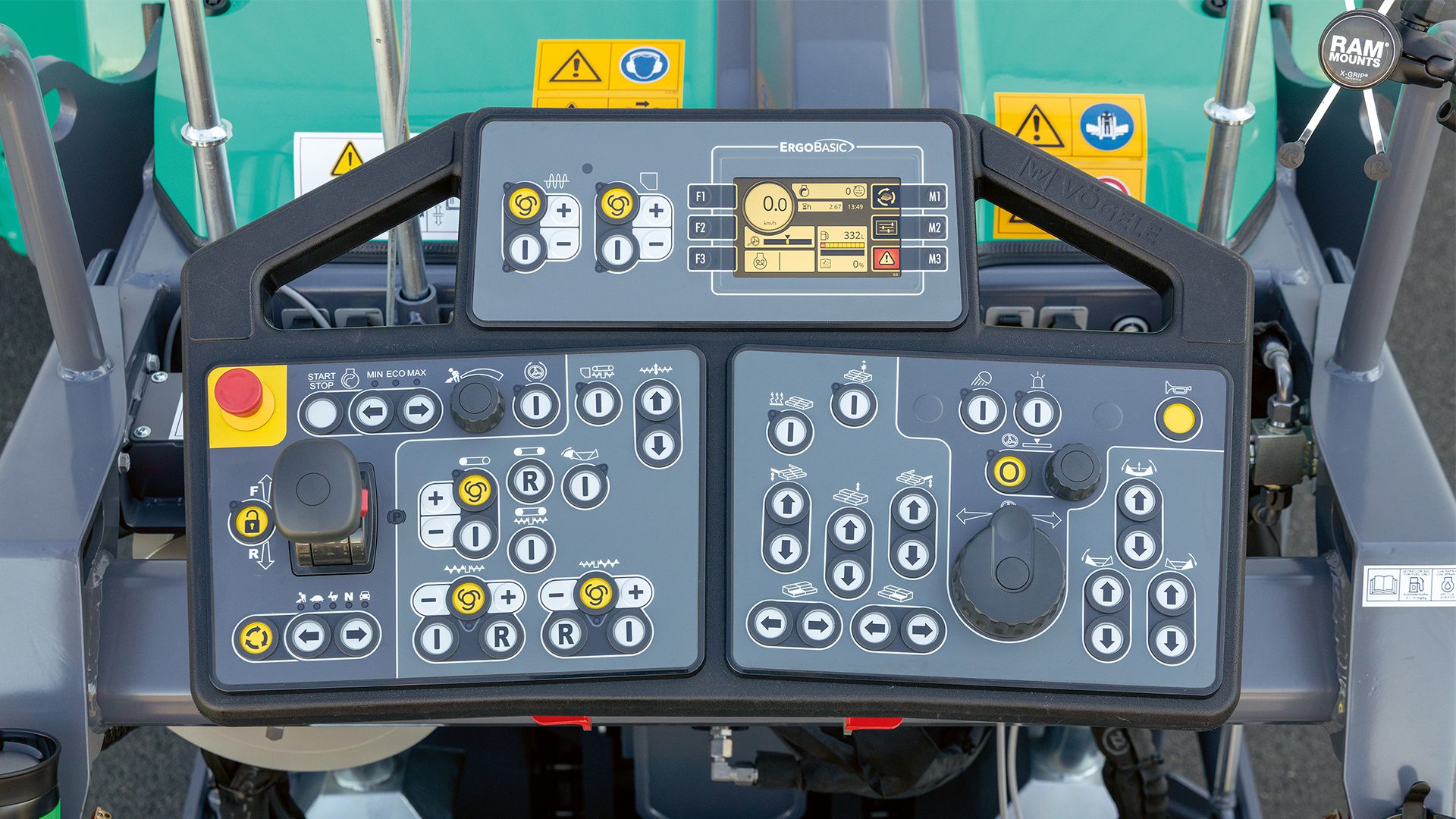 Vögele ErgoBasic control panel for road paver, showing display, joystick, and various controls.