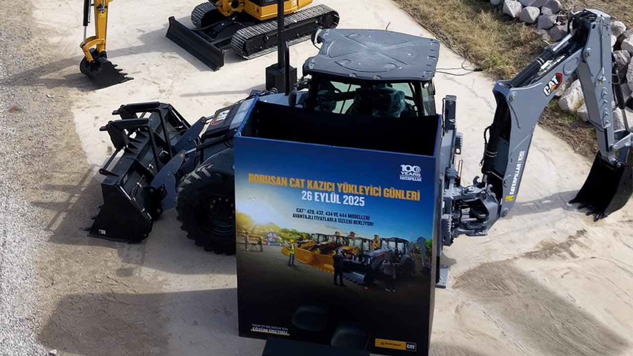 A Borusan Cat promotional sign for "Backhoe Loader Days" on Sept 26, 2025, with heavy machinery.