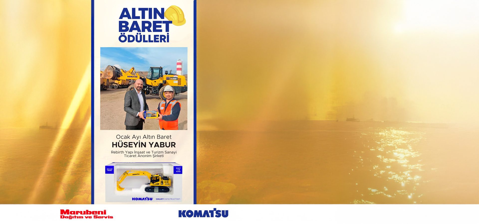 Hüseyin Yabur receiving the January Golden Hard Hat Award, with construction machinery background and Komatsu logos.