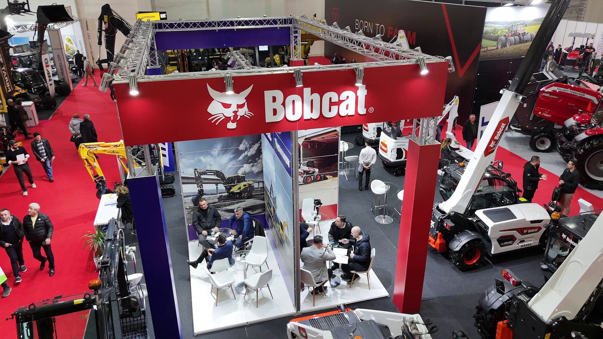 Motor vehicle, Automotive Tire, Agricultural machinery, Event, Exhibition, Flooring, Logo, Technology, Machine, Crowd