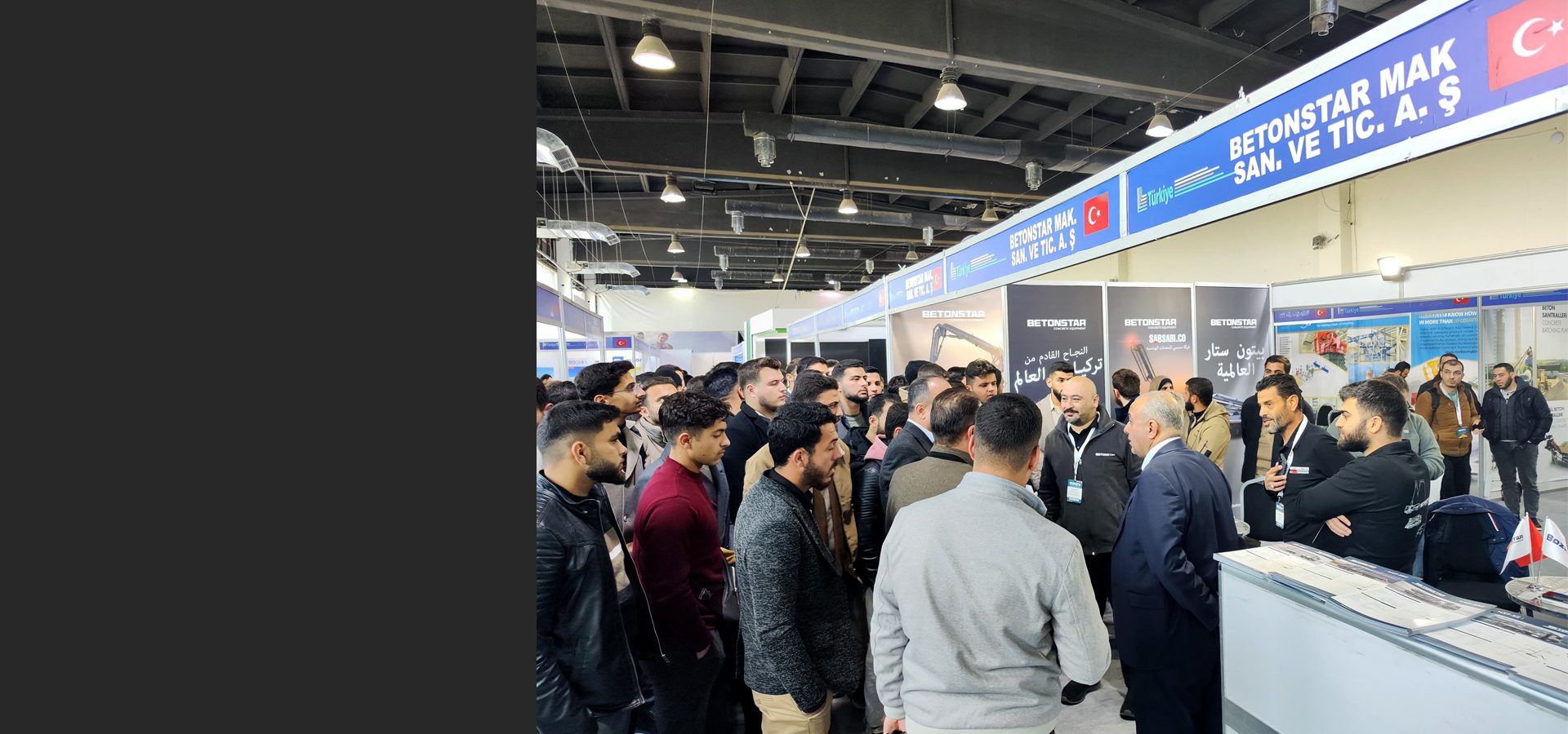 A crowded BETONSTAR MAK. SAN. VE TIC. A. Ş. booth at a trade show.
