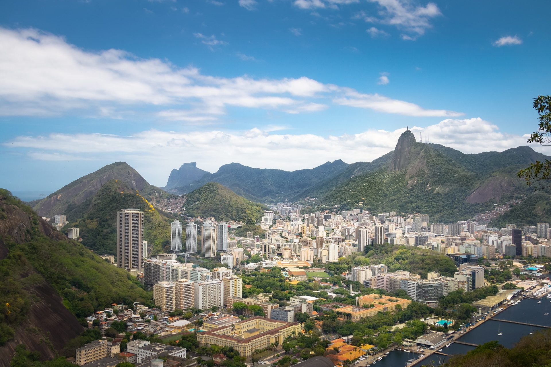 Tower block, Natural landscape, Cloud, Sky, Building, Mountain, Skyscraper, Nature, Vegetation, Highland