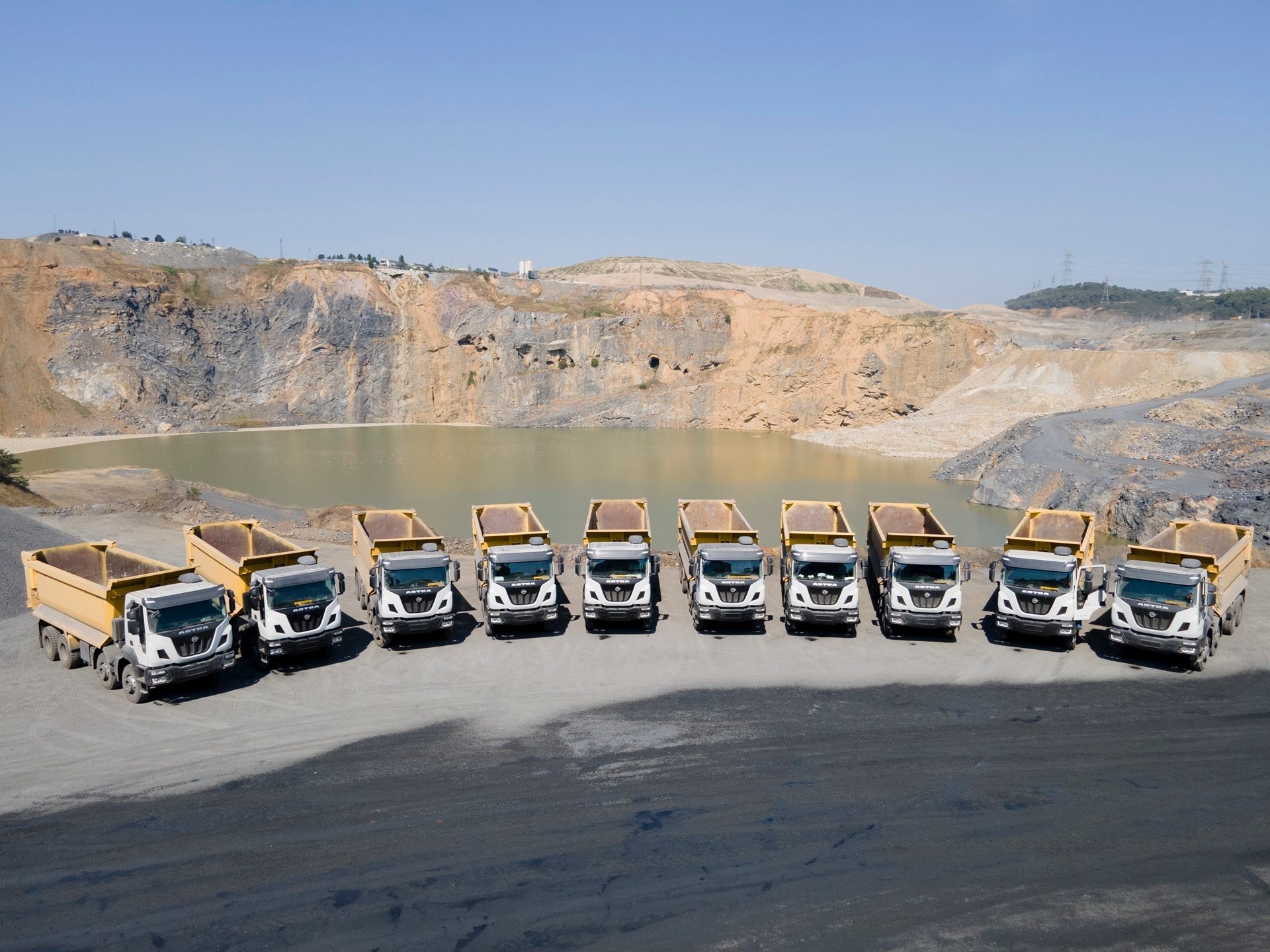 Mode of transport, Motor vehicle, Automotive tire, Water, Sky, Asphalt, Landscape, Slope