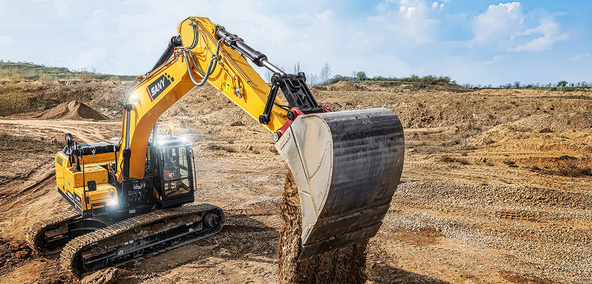Yellow SANY excavator dumping dirt at a construction site.